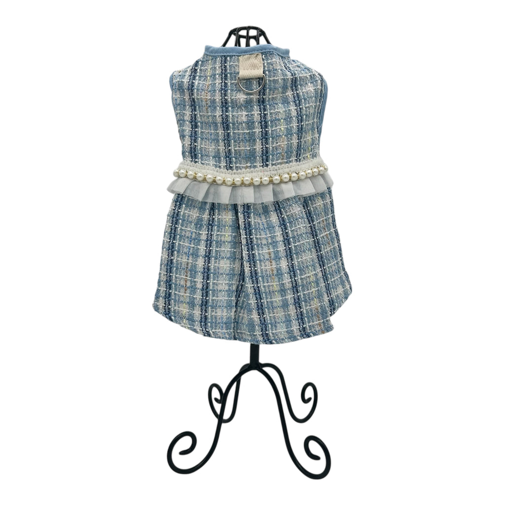 Blue plaid cat dress with pearl details on a mannequin against a white background
