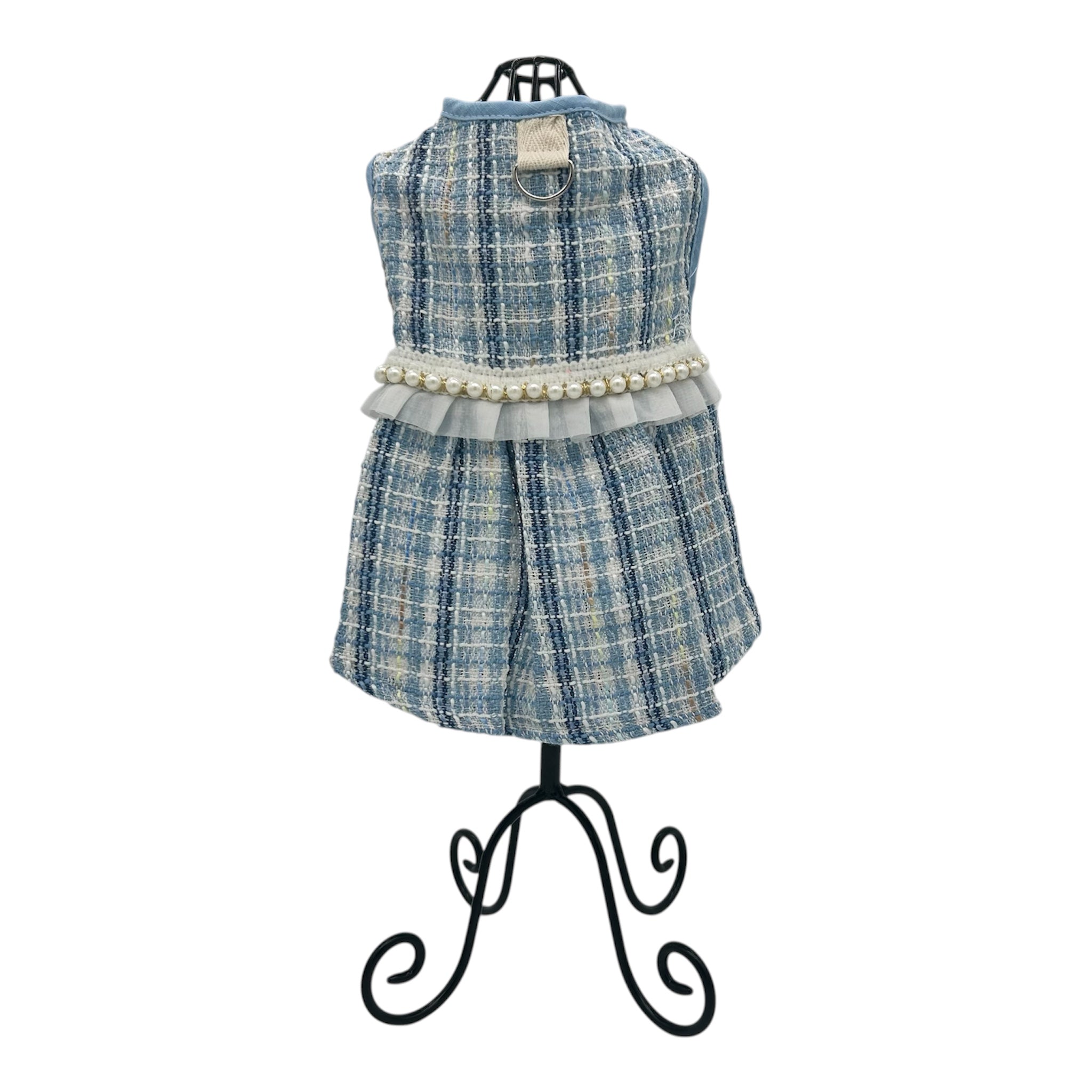 Blue plaid cat dress with pearl details on a mannequin against a white background