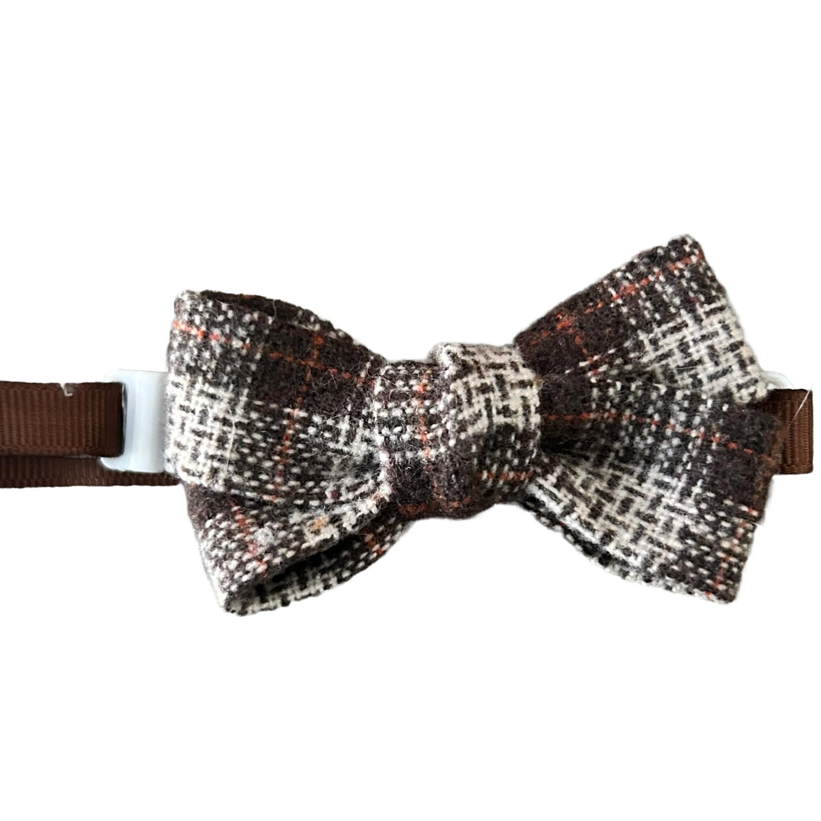 Houndstooth patterned bow tie with brown ribbon on a white background
