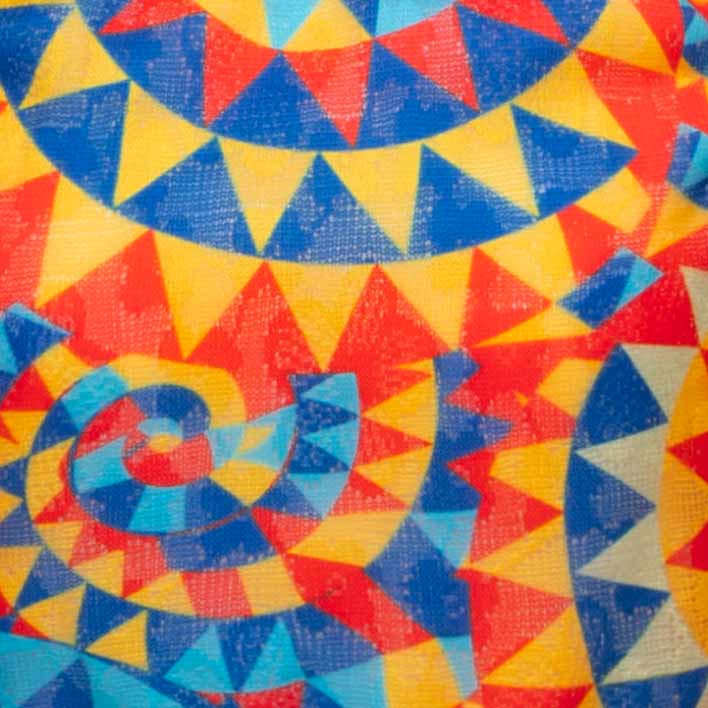 Colorful geometric pattern with triangles in red, yellow, and blue dress