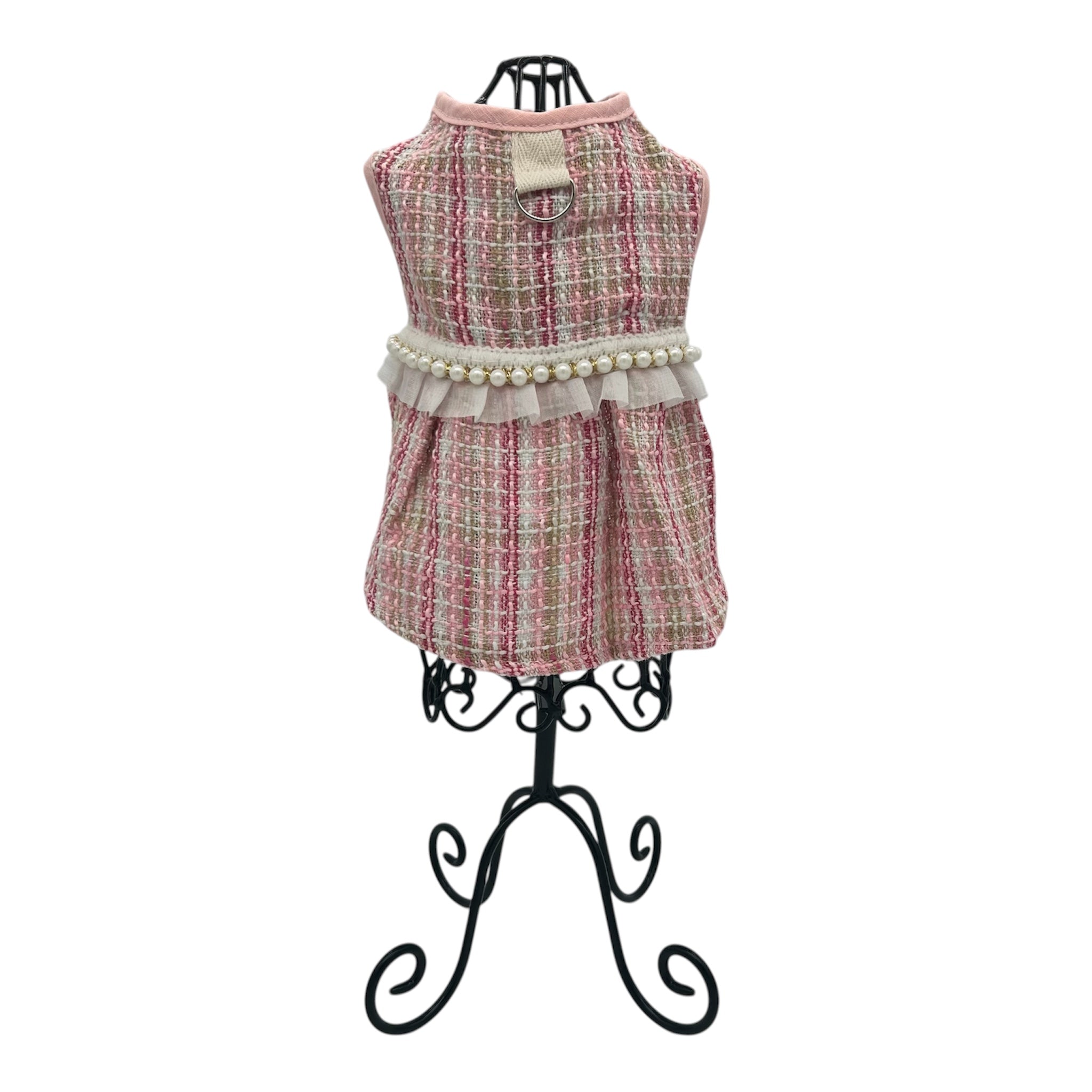 cat dress with plaid pattern and pearl details on a mannequin against a white background