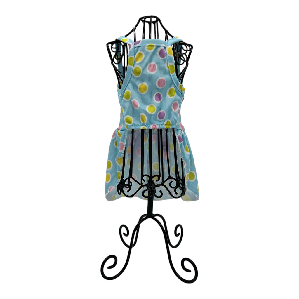 Colorful polka dot cat dress  on a black mannequin stand against a white background