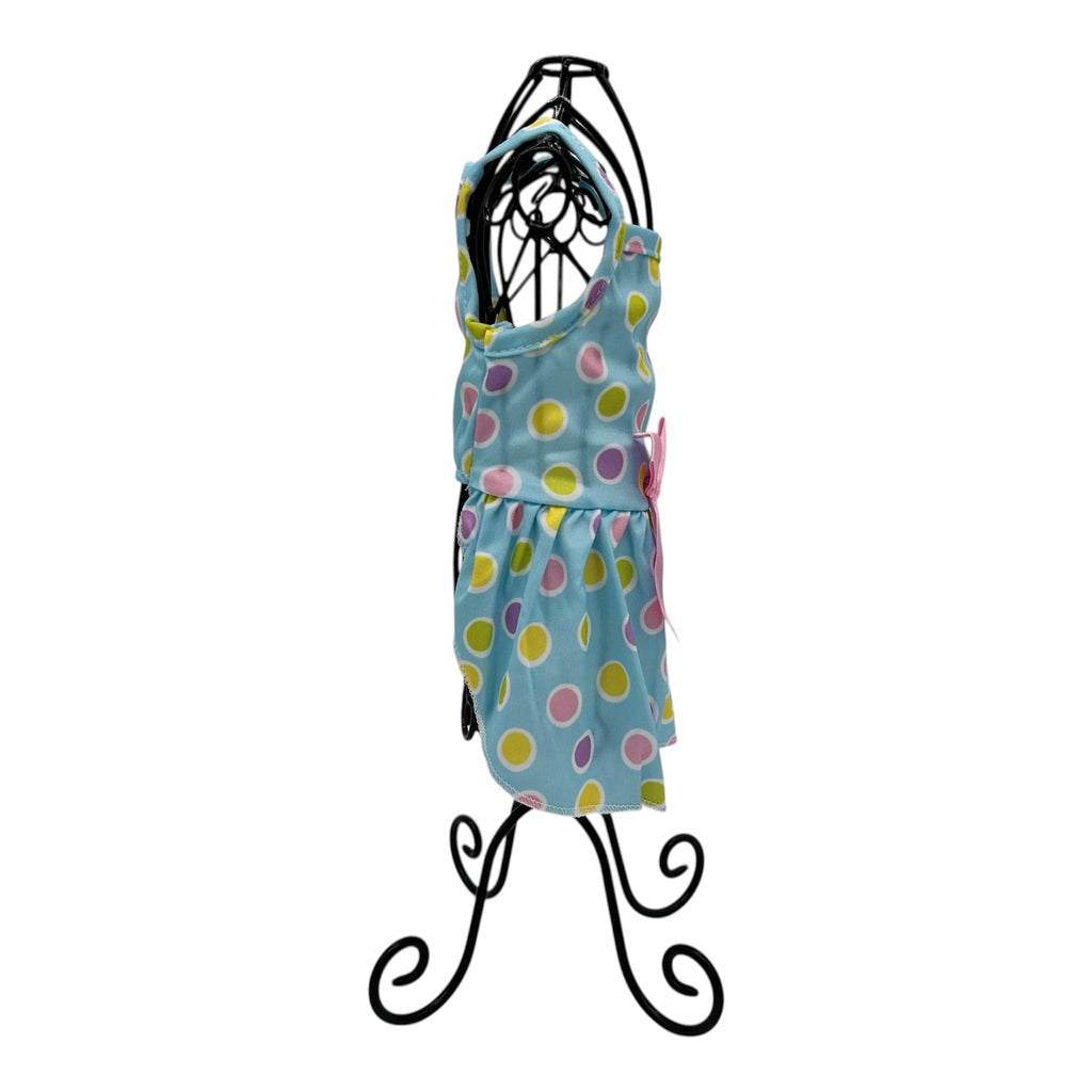 Polka dot cat dress on a black mannequin against a white background