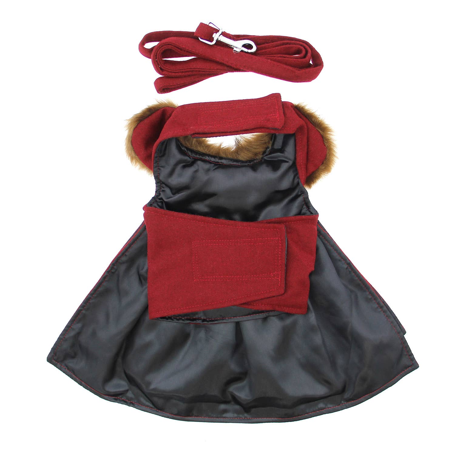 Cat coat with red trim and matching leash on a white background